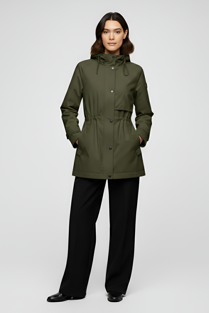 Woman wearing a green raincoat on a white background