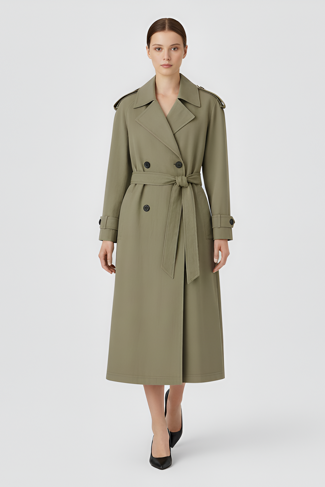 Woman wearing a green trench coat on a white background