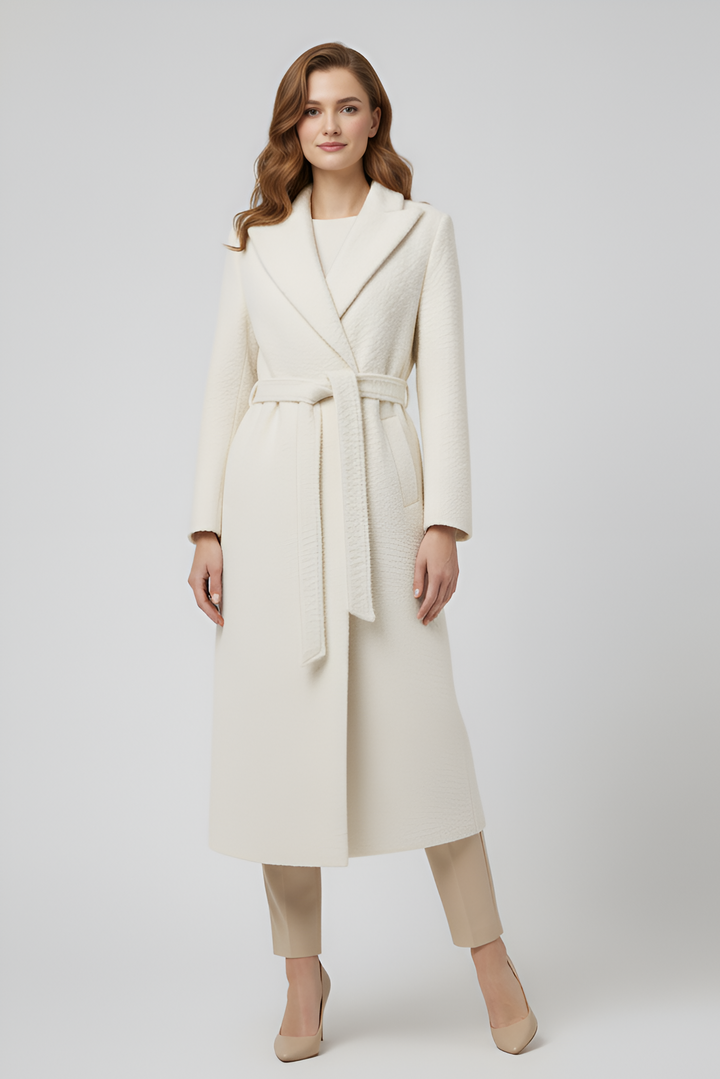 Woman wearing a white coat on a white background