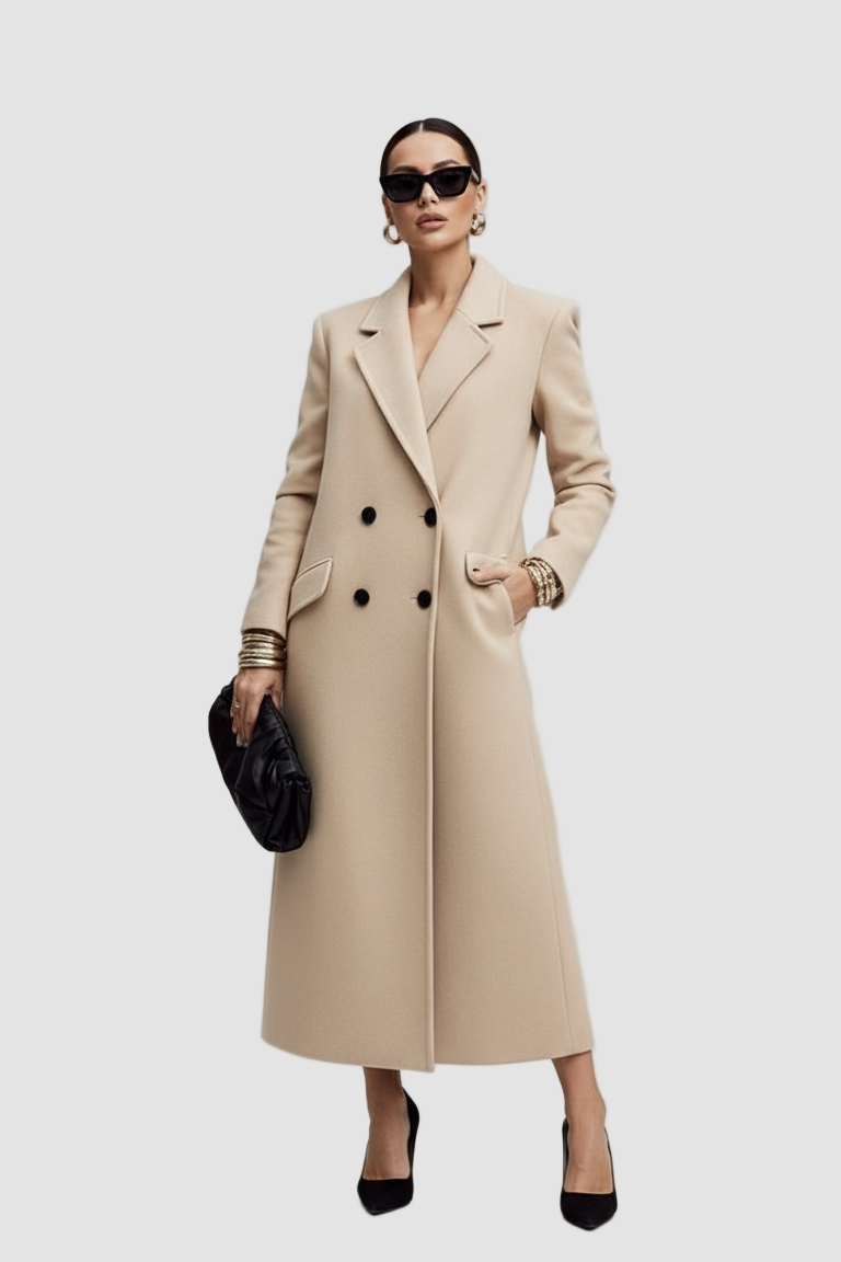 Woman wearing a long beige coat on a white background