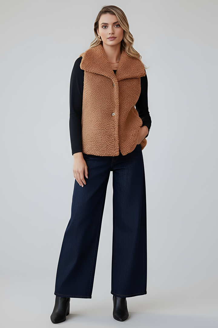 Women’s winter faux fur coat in brown with soft textured finish.