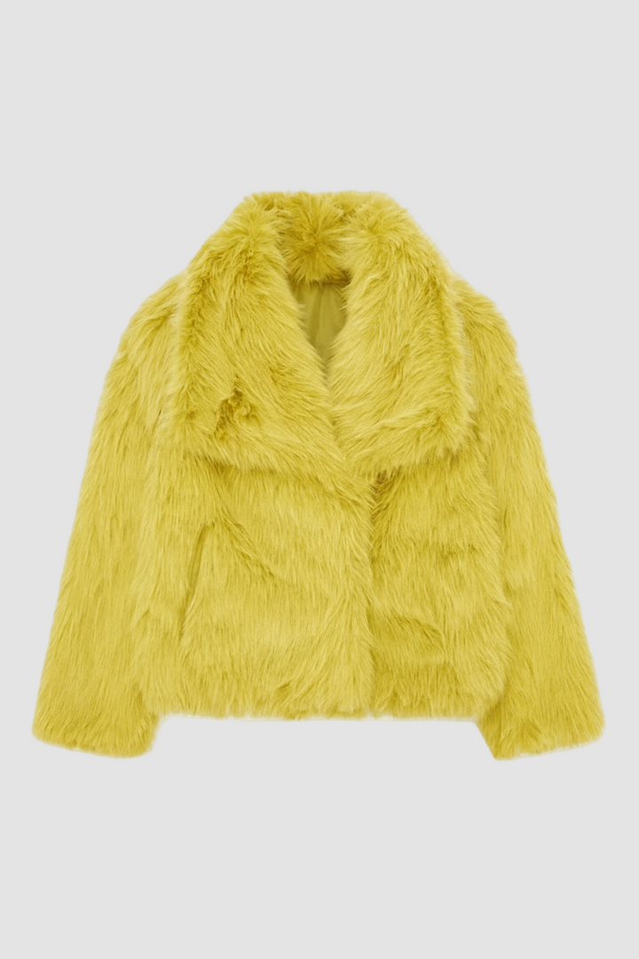 Yellow fur coat on a white background