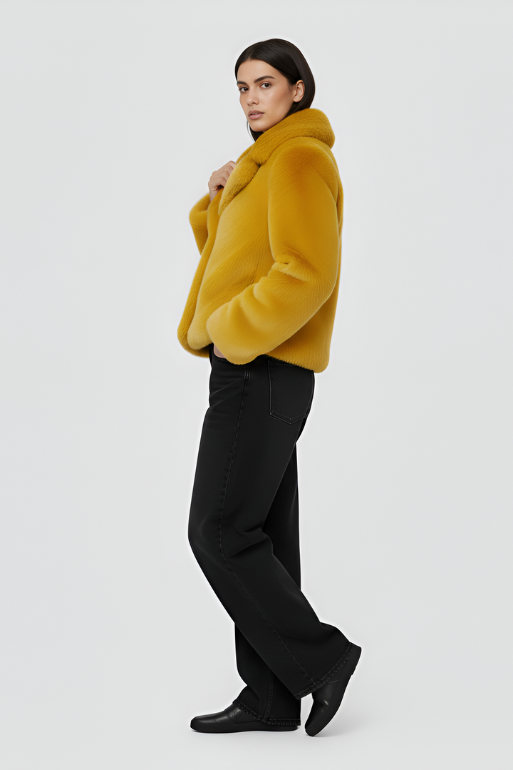 Yellow fur coat on a white background