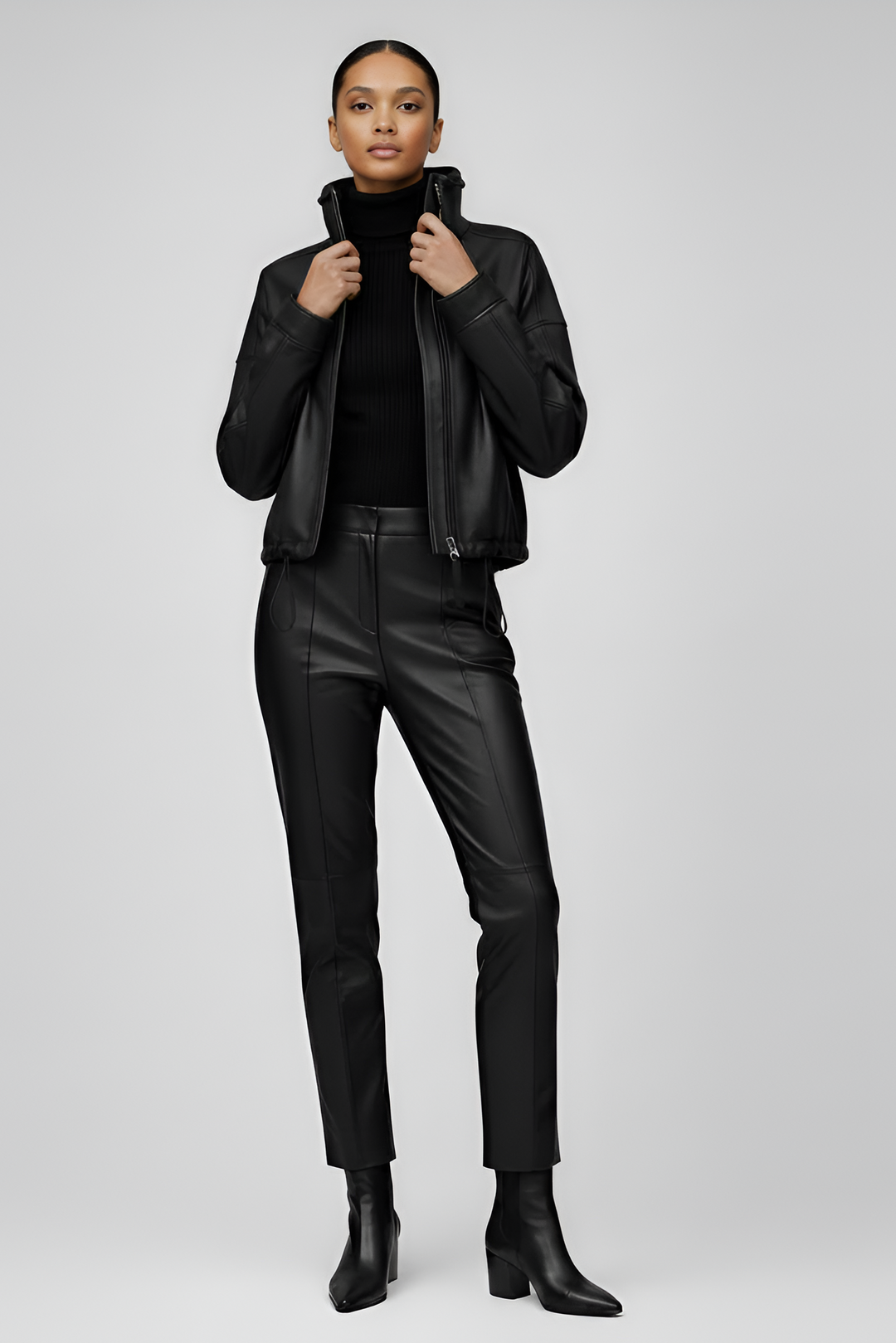 Full body look women wearing black bubble leather jacket and leather pants