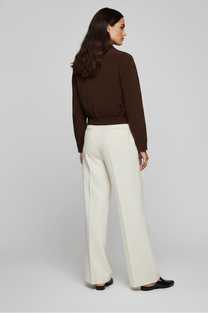 BRADLEY - Full back shot of brown suede bomber jacket on a mannequin