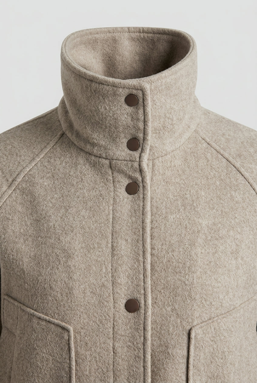 Close-up of the CORA stand collar and snap button front