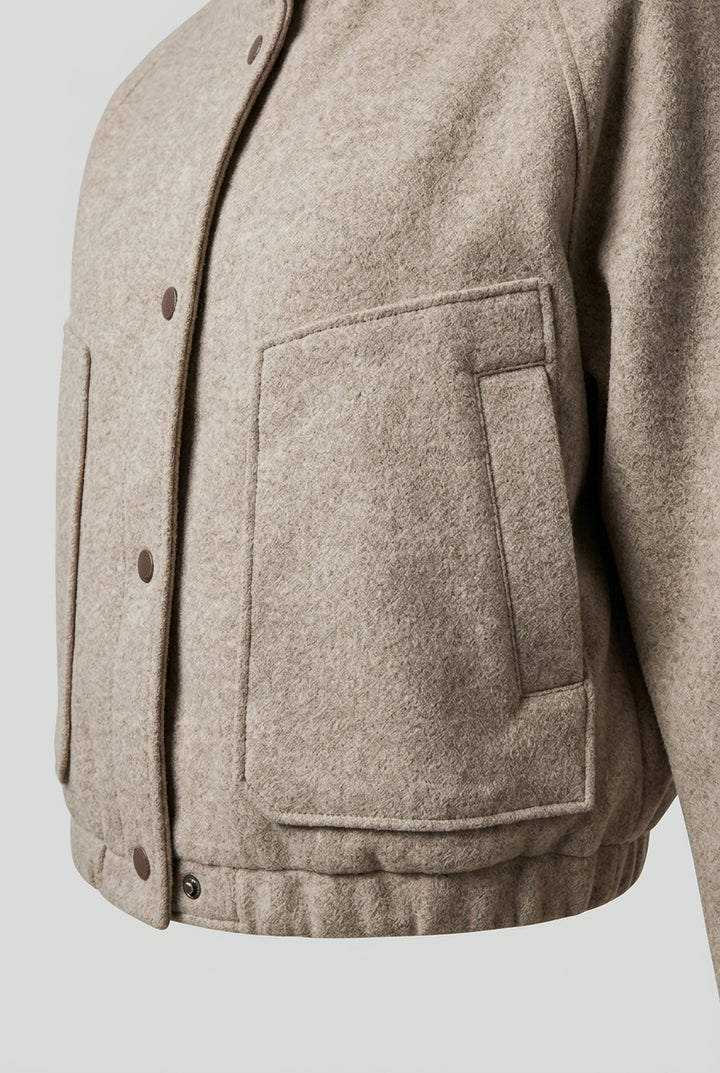 Close-up of the CORA patch pocket and snapped hem band