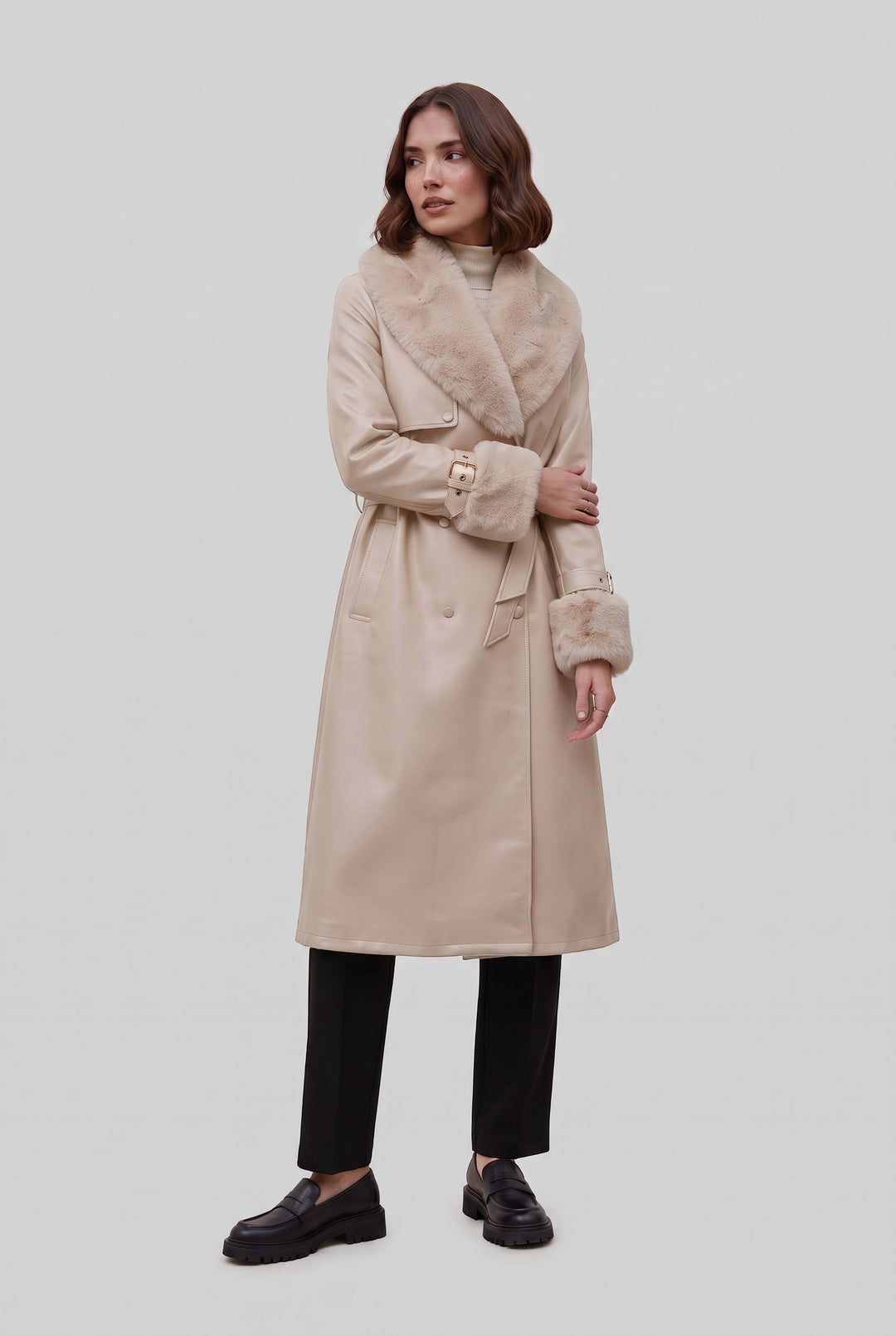 Woman wearing the DELANEY fur trim faux leather trench coat in beige, front view