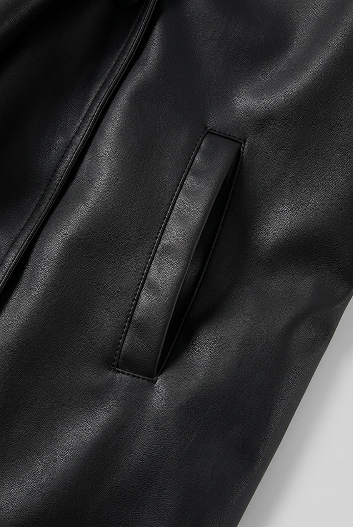 Close-up of the welt pocket on the front panel on the DELANEY fur trim faux leather trench coat