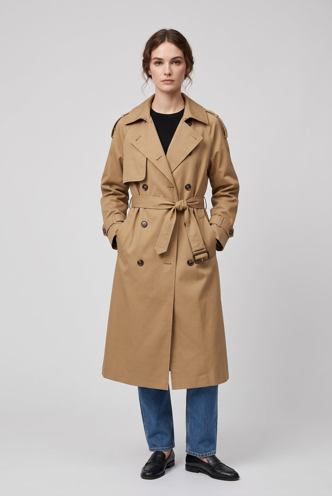 Woman wearing the MEREDITH long double-breasted belted trench coat in khaki, front view
